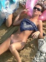 Voyeur shots of a couple of sunbathing naked hotties