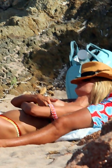 Heidi Klum - Caught Topless At A Beach In Italy 07/31/15